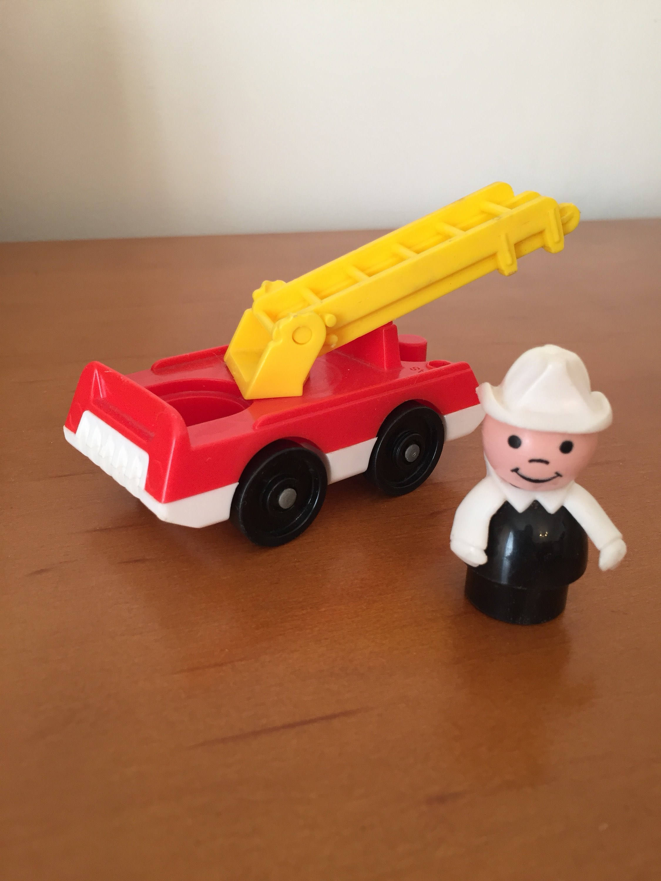 Vintage Fisher-Price Little People Fireman with Fire Truck