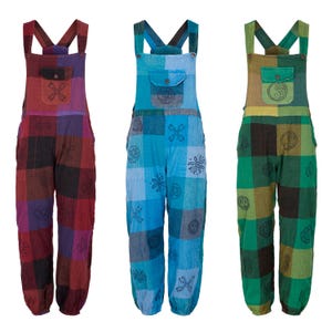 May include: Three pairs of patchwork overalls in vibrant colours. Each pair features adjustable straps, a front pocket, and a loose fit. The colour schemes are red and purple, blue, and green, each with unique patterns and symbols.