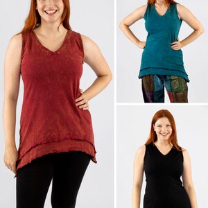 May include: A collection of sleeveless V-neck tops in various colors: rust, teal, and black. The tops have a layered, asymmetrical hemline. The model is wearing black capri leggings and olive green pants in the other images.
