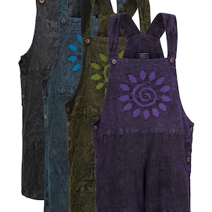 May include: Four pairs of denim overalls in varying colors: black, teal, olive green, and purple. Each pair features a floral design on the bib and wooden buttons. The overalls have a relaxed fit and pockets.