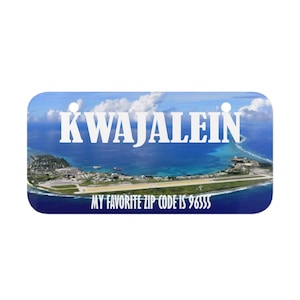 May include: A blue and white metal sign with the text "Kwajalein" and "My favorite zip code is 96885". The sign features an aerial view of a tropical island with a runway.