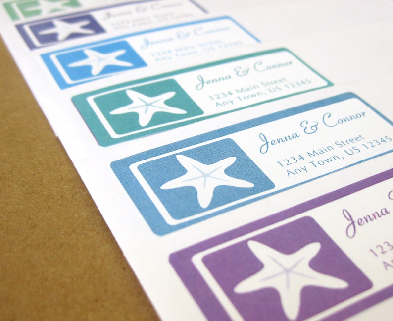 May include: A set of five address labels with a white starfish design on a blue, green, purple, and teal background. The labels have the text "Jenna & Connor" and an address on them.