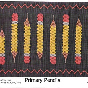 May include: A black background with a repeating pattern of yellow, red, and white pencils. The pencils are arranged vertically. The text "Primary Pencils" is at the bottom. Red zig-zag lines border the top and bottom.