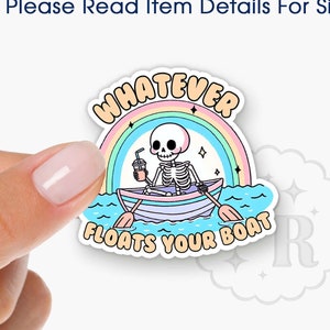 May include: A colorful acrylic badge reel topper featuring a skeleton in a boat with the text "Whatever Floats Your Boat".