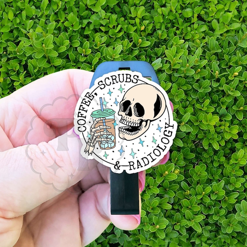 May include: A sticker with the text "COFFEE, SCRUBS & RADIOLOGY" and a skull graphic holding a coffee cup with ice cubes. The sticker is white with black and teal accents, and is placed on a black object.
