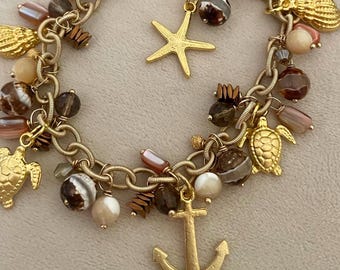 Braccialetto con ciondolo a forma di stella marina dorata/Braccialetto con ciondolo a tema spiaggia/Gioielli nautici/Braccialetto con ciondolo a forma di tartaruga/Gioielli con conchiglie/Regalo per gli amanti della spiaggia