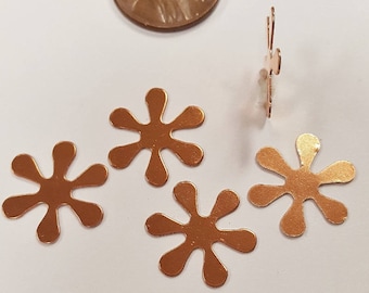 Può includere: Cinque forme di fiori in metallo color rame con otto punti ciascuna. Le forme dei fiori sono approssimativamente delle dimensioni di una moneta da un centesimo di euro.