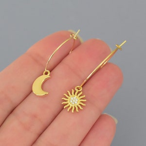 18K gold filled brass moon and sun charms on 18K gold 316 surgical stainless steel round hoop earrings . Minimalist super thin hoop ear wires by WrappedinYou