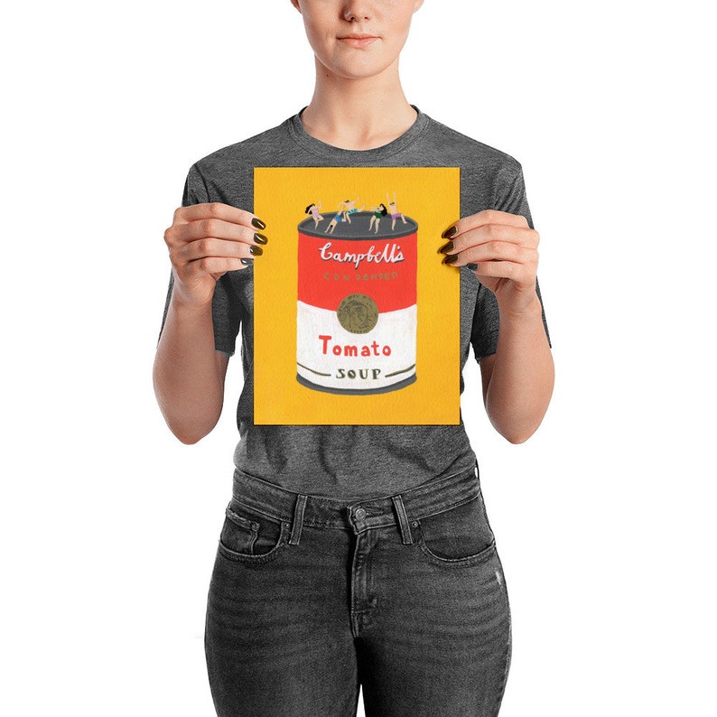 May include: A yellow background with a red and white Campbell's soup can. The can has a red label with the words "Campbell's Condensed Tomato Soup" and a gold label with the word "Tomato" and the words "Soup" in a smaller font. There are five people in the image, all wearing different colored clothing, standing on top of the can.