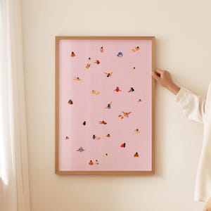May include: A framed print with a pink background and a pattern of people swimming in a pool. The people are all different colors and sizes, and they are swimming in various positions.