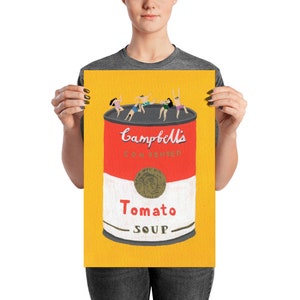 May include: A yellow background with a red and white can of Campbell's Condensed Tomato Soup.  Five people are swimming in the soup.