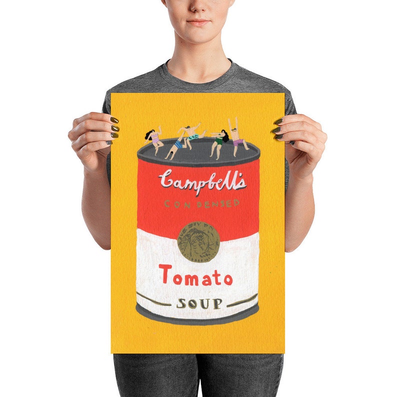 May include: A yellow background with a red and white can of Campbell's Condensed Tomato Soup.  Five people are swimming in the soup.