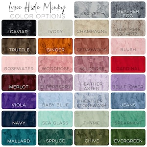 May include: Color chart showing 24 different colors for Luxe Hide Minky fabric. Colors include: Caviar, Ivory, Champagne, Heather Quartz, Truffle, Ginger, Cedarwood, Blush, Rosewater, Woodrose, Wildrose, Cardinal, Merlot, Elderberry, Heather Aster, Bellflower, Viola, Baby Blue, Heather Stonewash, Jeans, Navy, Sea Glass, Thyme, Spearmint, Mallard, Spruce, Chive, Evergreen.