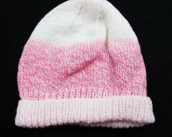 Hand knitted traditional beanie hat in pink and white 20 inch head