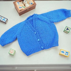 Hand-Knitted Blue Baby Cardigan, Newborn Knitwear with Cute Duck Buttons