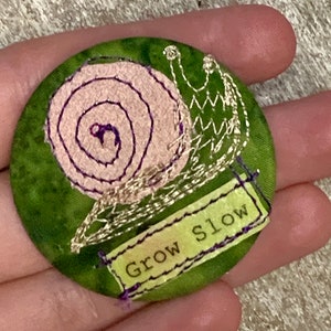 Snail fabric art collage pinback button badge