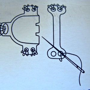 May include: A black and white line drawing of two sewing machine parts with a needle and thread going through one of the parts.