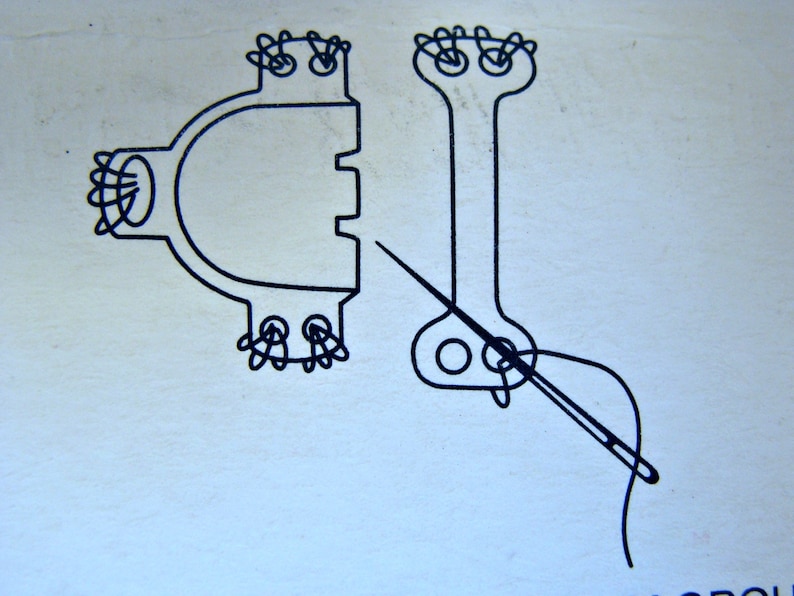 May include: A black and white line drawing of two sewing machine parts with a needle and thread going through one of the parts.