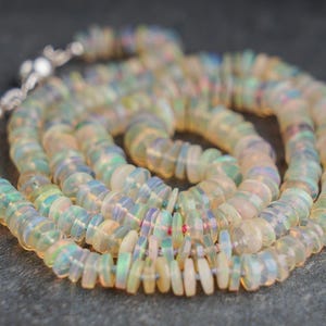 Welo opal necklace /// natural Ethiopian heishi opals knotted on multicoloured silk with sterling silver clasp • gemstone beaded necklace