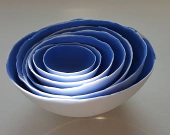 Set of 7 stoneware fine bone china nesting bowls in blue and white.