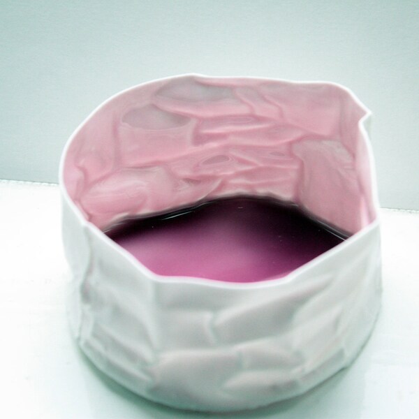Paper thin crumpled paper looking vessel made out of stoneware English fine bone china with purple resin.