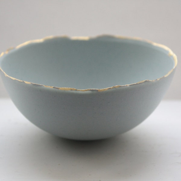 Blue porcelain bowl. Stoneware porcelain bowl in duck egg blue with gold rims.