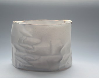 White with gold vessel. Crumpled paper-looking vessel made out of fine bone china with real gold