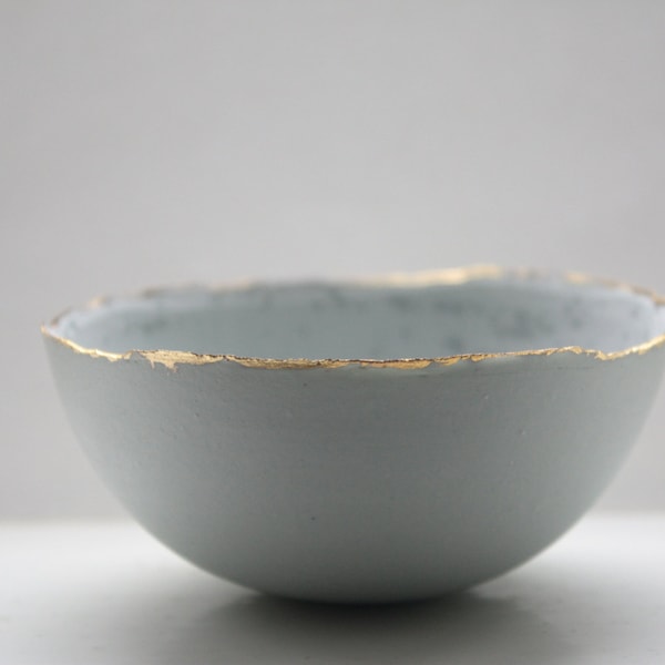 Stoneware Parian porcelain bowl in duck egg blue with mat gold rims mat interior and crystals.