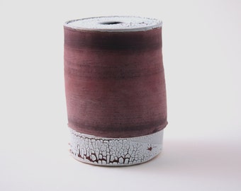 Handthrown earthenware vessel with unique texture and powder effect in red color