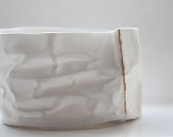 Small vessel. Crumpled paper looking vessel made out of fine bone china with real gold lines