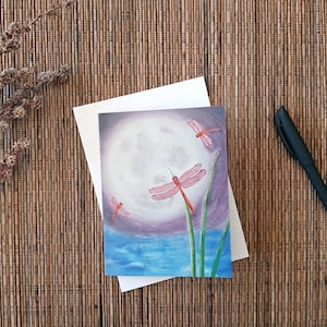 Whimsical and Wild Blank Note / Gift Card - Red Dragonflies and large Luminous Full Moon with Rich Purple sky and Soft Blue Water