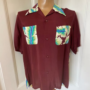 Rare maroon rayon Hawaiian shirt by Aloha Kanaka with amazing print image 1
