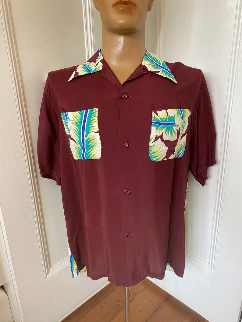Rare maroon rayon Hawaiian shirt by Aloha Kanaka with amazing print image 1