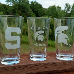Pair of MSU Spartan Officially Licensed Etched Glasses – 16 oz Pint Glasses (#8112)