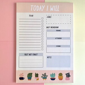 May include: A notepad with the text "TODAY I WILL" at the top. It has sections for "TO DO", "GOALS", "DAILY BREAKDOWN", "MUST NOT FORGET", and "NOTES". The bottom features a row of potted plants in various designs.