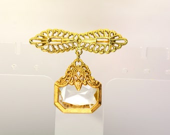 ST.JOHN ブローチ ST. JOHN Massive Round Black and Gold With Rhinestones