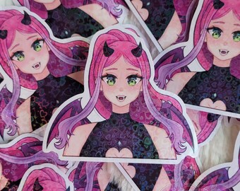 May include: A sticker featuring a cartoon character with pink hair, green eyes, and devil horns. The character is wearing a black and purple outfit with a heart-shaped design. The background is a glittery pattern of hearts.
