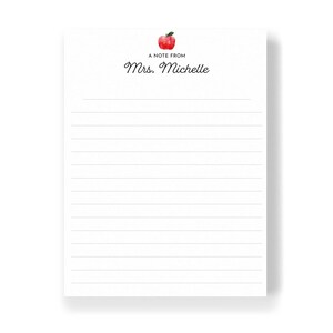 A blank lined notepad with a watercolor apple illustration on the top left corner.