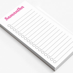 May include: A white notepad with a pink name "Samantha" at the top and a dotted line checklist.