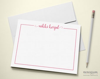 May include: White stationery with a red border and the name "nikki korjal" written in pink cursive.