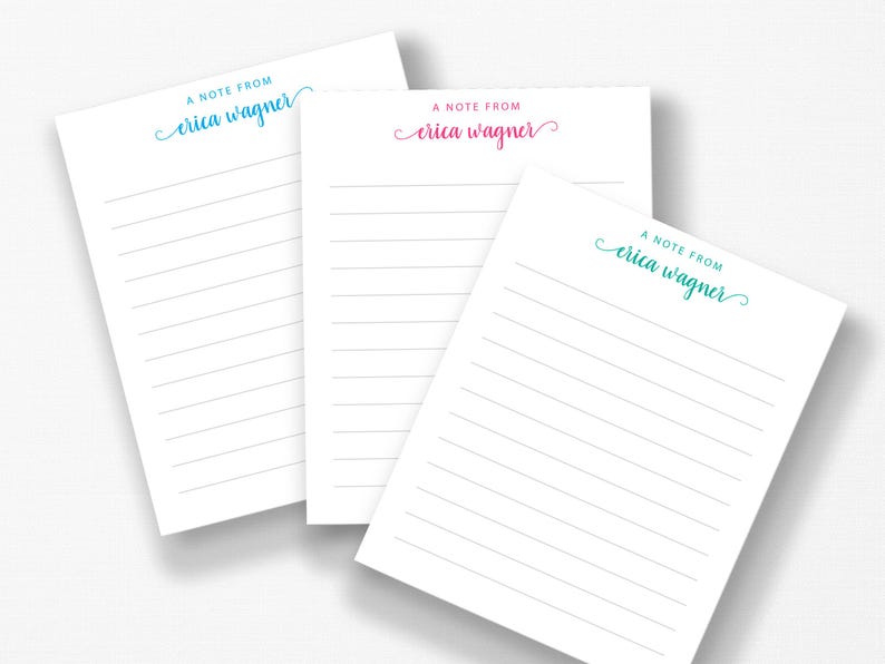 three blank lined notepads with the name 'Ella Wagner' printed on them.