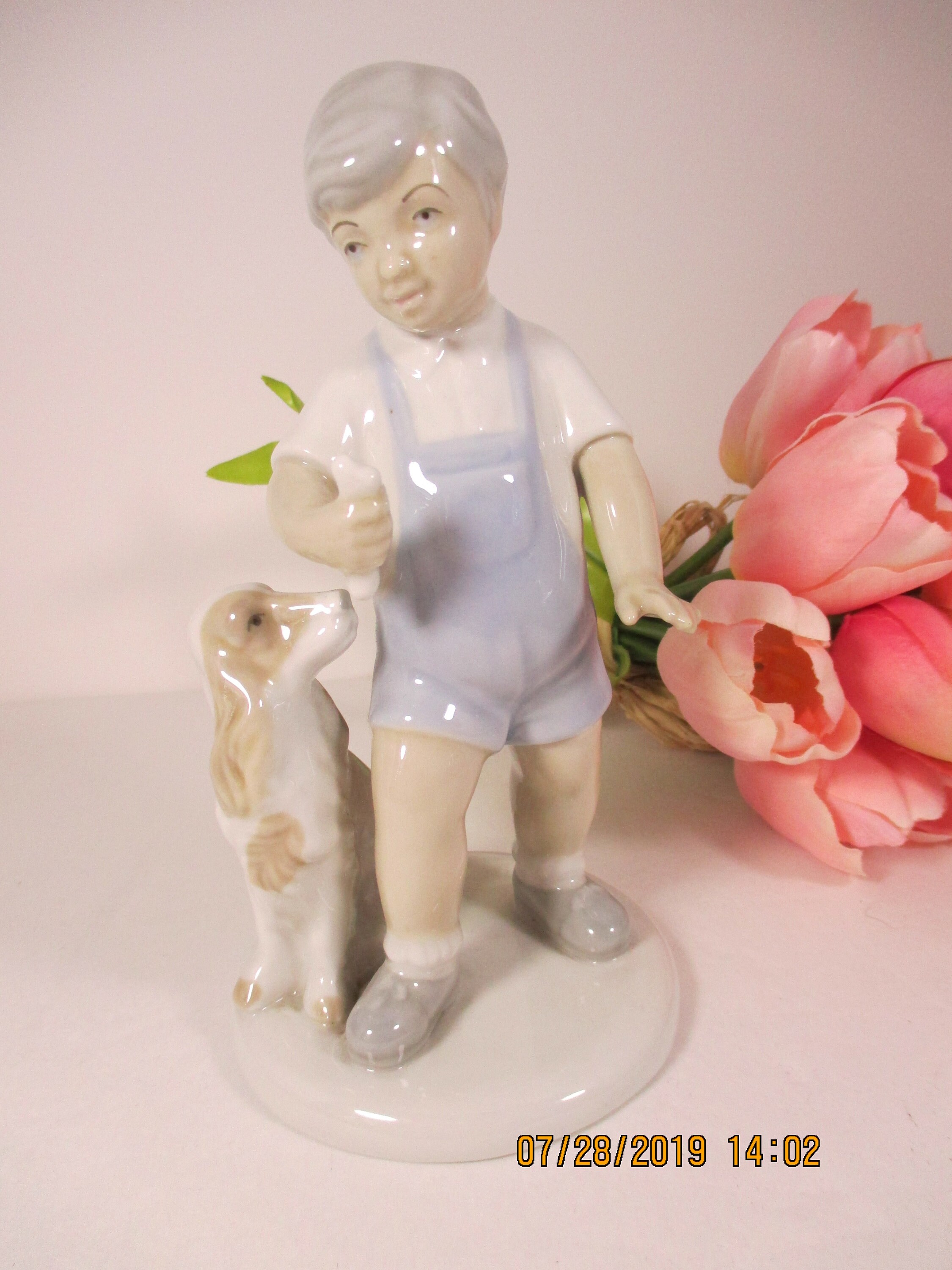 lladro figurines boy with dog