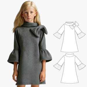 Pode incluir: Um vestido cinza com um grande laço no pescoço e mangas bufantes. O vestido é mostrado em uma modelo e também é ilustrado em um desenho de linha.