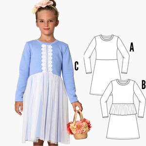 May include: A blue and white dress with a lace trim and a tulle skirt. The dress has long sleeves and a round neckline. The dress is shown on a model wearing a flower crown and holding a basket of flowers.