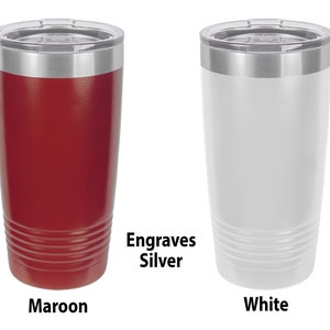 May include: Two stainless steel tumblers, one maroon and one white, with silver lids. The tumblers have a textured design and the text "Engraves Silver" is printed below the tumblers.