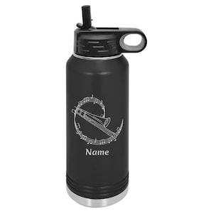 May include: Black stainless steel water bottle with a straw lid and a design of a trombone with musical notes. The bottle has a silver bottom and the text "Name" is engraved on the bottle.