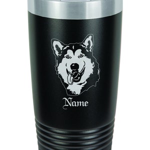 May include: Black stainless steel tumbler with a white Alaskan Malamute dog graphic and the word "Name" engraved on the side.