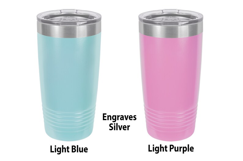 May include: Two stainless steel tumblers with lids. The tumbler on the left is light blue and the tumbler on the right is light purple. Both tumblers have a silver band around the top and engrave silver.
