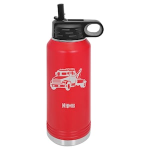 May include: Red stainless steel water bottle with a black lid and a straw. The bottle has a white silhouette of a tow truck with the word "NAME" below it.