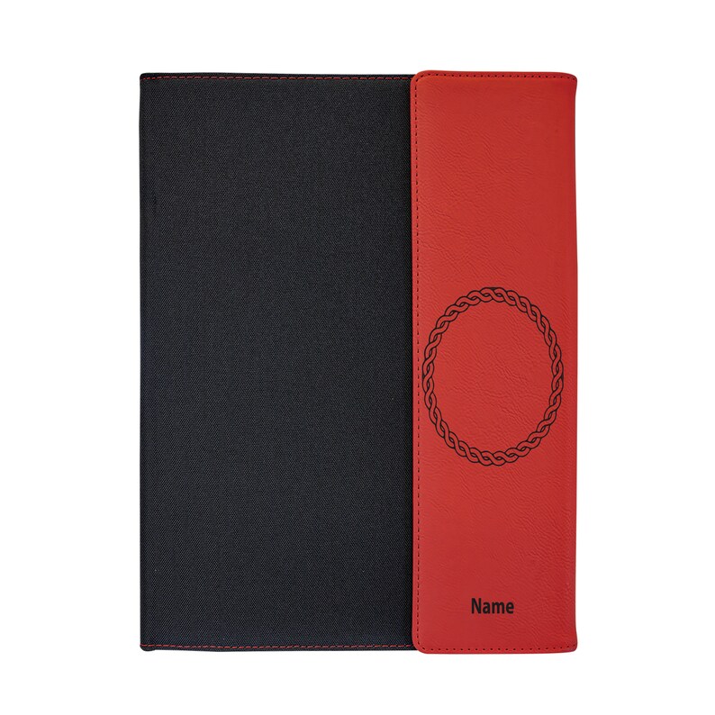 May include: A black and red leather notebook with a decorative circle design and the word "Name" on the front.